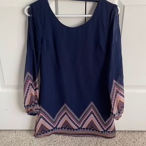 Dark blue dress with Aztec print around bottom.